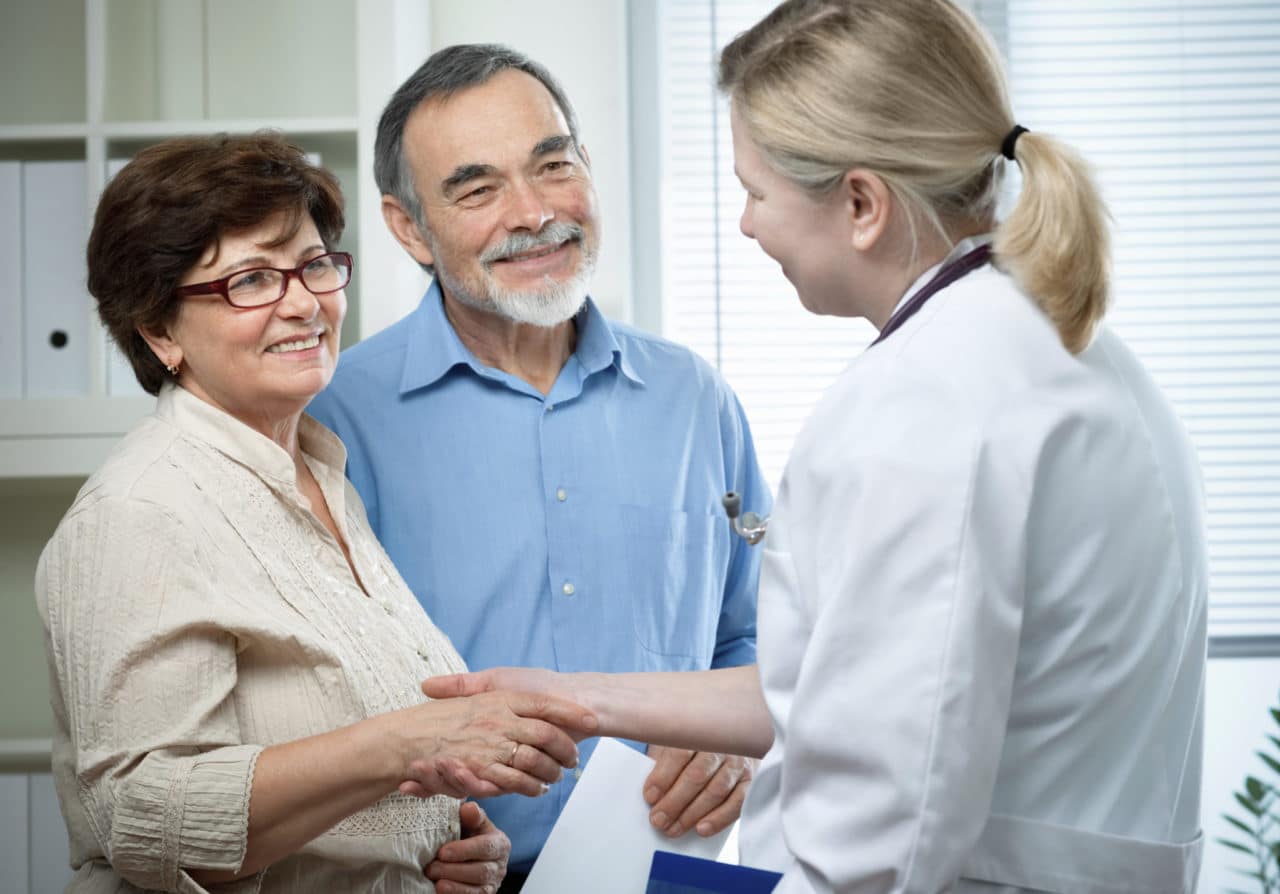 A provider meeting an couple for consultation