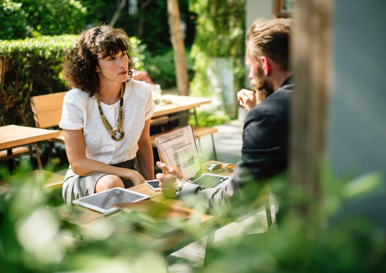 Two people facing each other in conversation