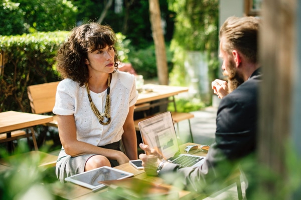 Two people facing each other in conversation