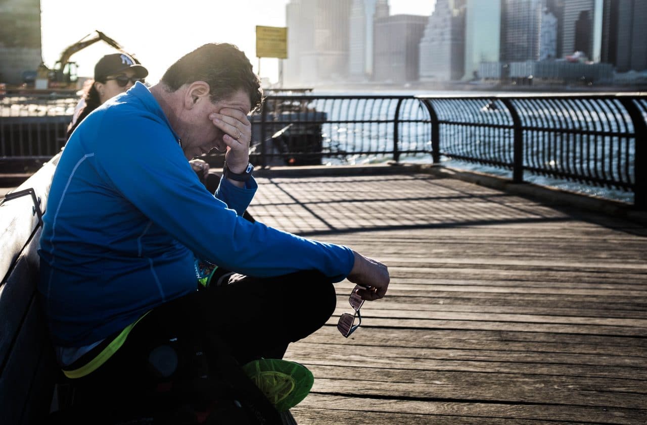 Man rubbing his eyes out of fatigue